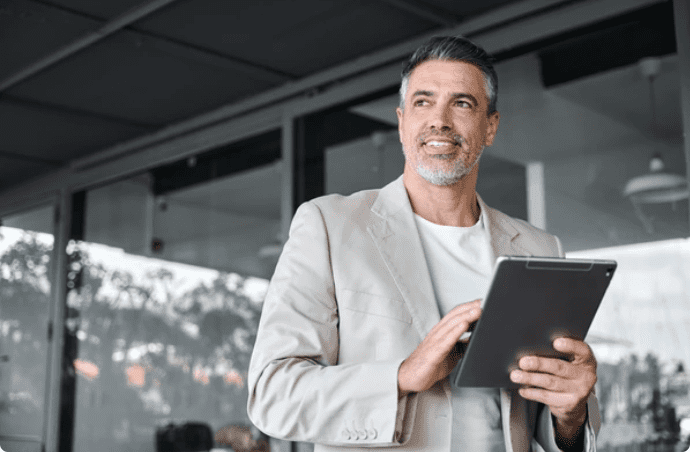 Business Executive holding a tablet